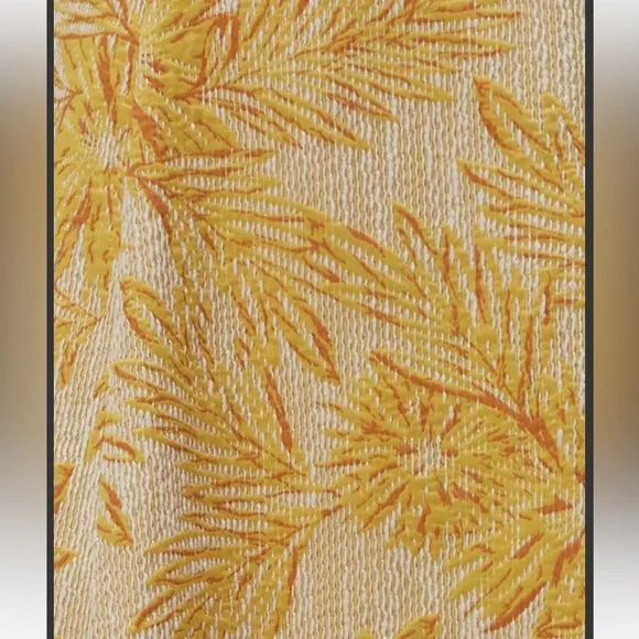 Yellow jacquard strapless gown